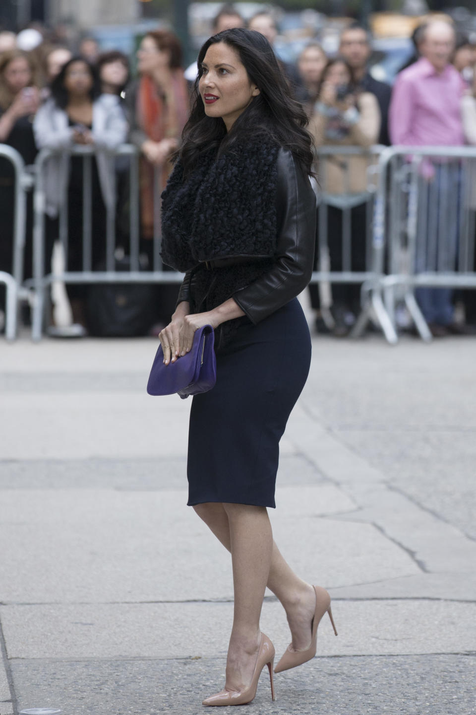 Actress Olivia Munn arrives at St. Bartholomew's Church for a memorial service for fashion designer L'Wren Scott, Friday, May 2, 2014, in New York. Scott committed suicide on March 17 in her Manhattan apartment. (AP Photo/John Minchillo)