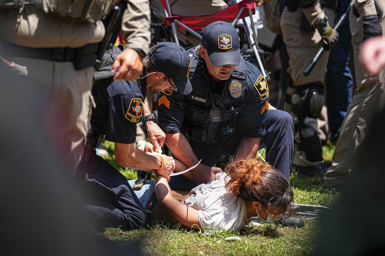 University of Texas at Austin police arrest a protester at an encampment where demonstrators gathered to call attention to the war in Gaza on Monday, April 29, 2024.