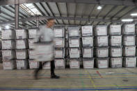 A worker carries a ballot box at Central Election Committee counting center in Fushe Kosove, Kosovo on Monday, Oct. 7, 2019. Kosovo's opposition parties have won a snap election, overcoming the former independence fighters who have governed the country since its war 20 years ago. With 96% of the votes counted Monday the left-wing Movement for Self-Determination Party, or LVV, has 26% of the votes, one percentage point more than the conservative Democratic League of Kosovo, or LDK, also formerly in opposition. (AP Photo/Visar Kryeziu)