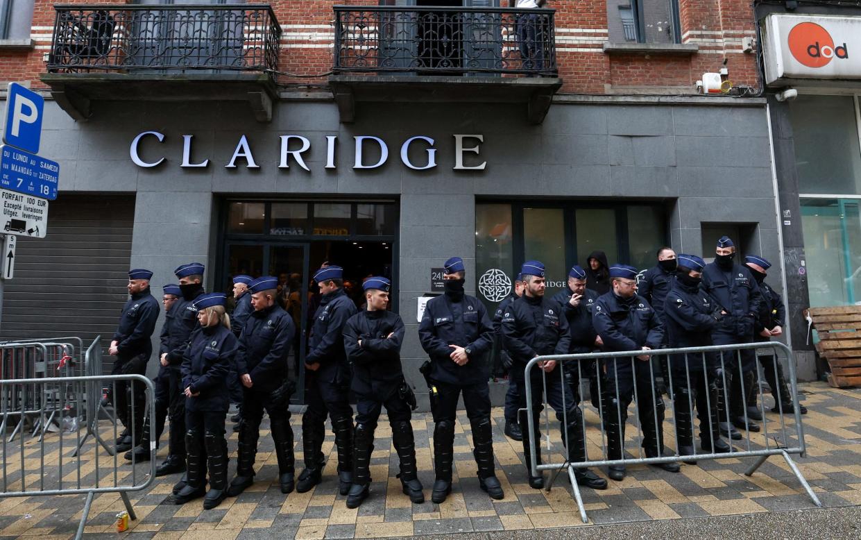 Police officers secure the area outside the venue where a conference titled "National Conservatism" takes place, in Brussels