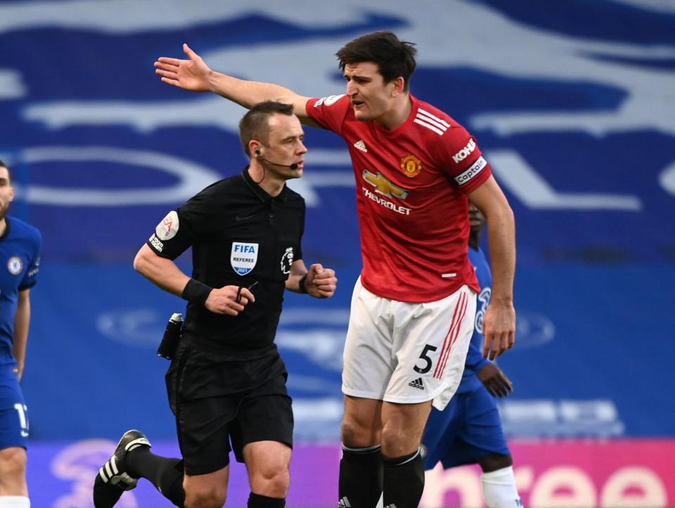 Referee Stuart Atwell and Manchester United captain Harry Maguire (Getty Images)