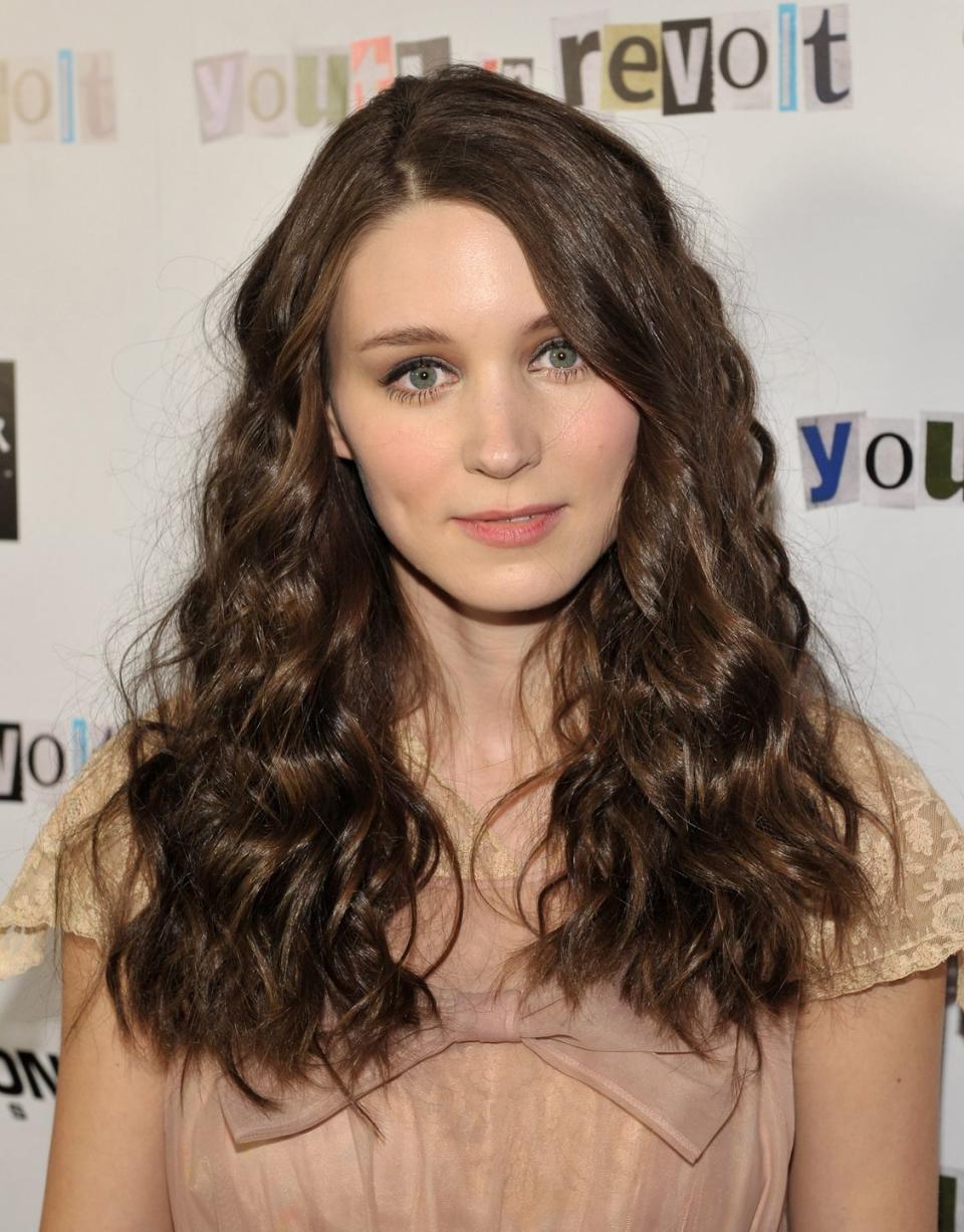 <p>As an up-and-coming actress, Rooney Mara styled her shoulder-length hair with curls, as see here at the premiere for <em>Tanner Hall </em>at the Toronto Film Festival in 2009. </p>