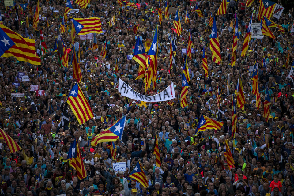 Catalan pro-independence protesters gather during a demonstration in Barcelona, Spain, Saturday, Oct. 26, 2019. Protests turned violent last week after Spain's Supreme Court convicted 12 separatist leaders of illegally promoting the wealthy Catalonia region's independence and sentenced nine of them to prison. (AP Photo/Emilio Morenatti)