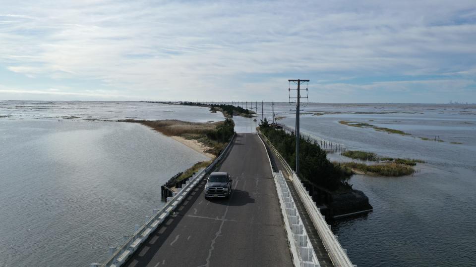 A fall high tide floods a coastal road in Southeastern New Jersey during an October 2019 king tide.  [Photos by Life on the Edge Drones, provided by Jacques Cousteau National Estuarine Research Reserve]
