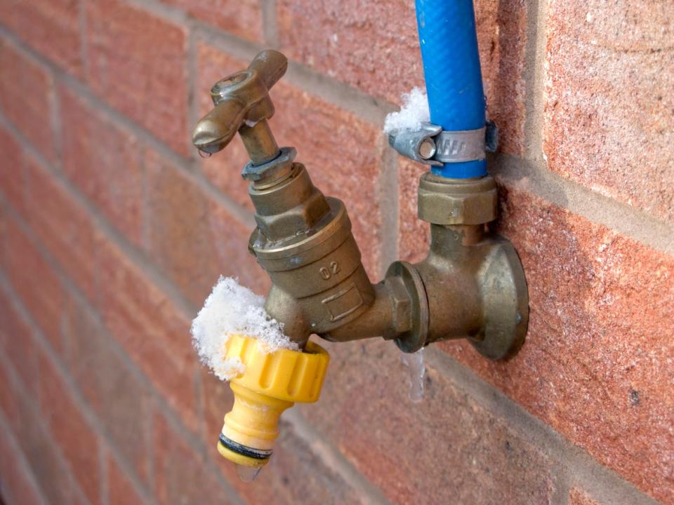 exterior faucet frozen with snow.