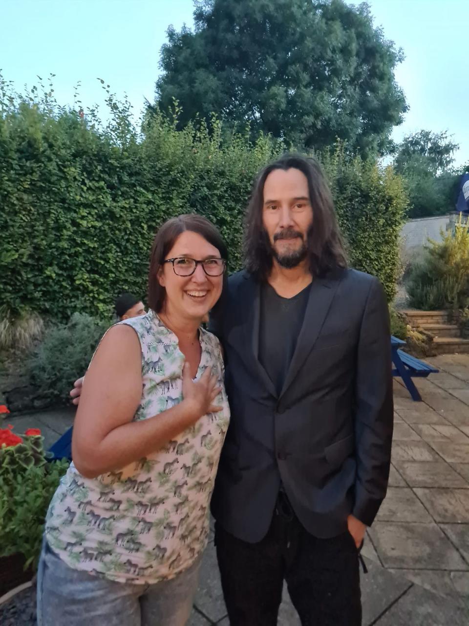 Dianne King, 46, poses with Reeves at her local pub (Dianne King / PA)