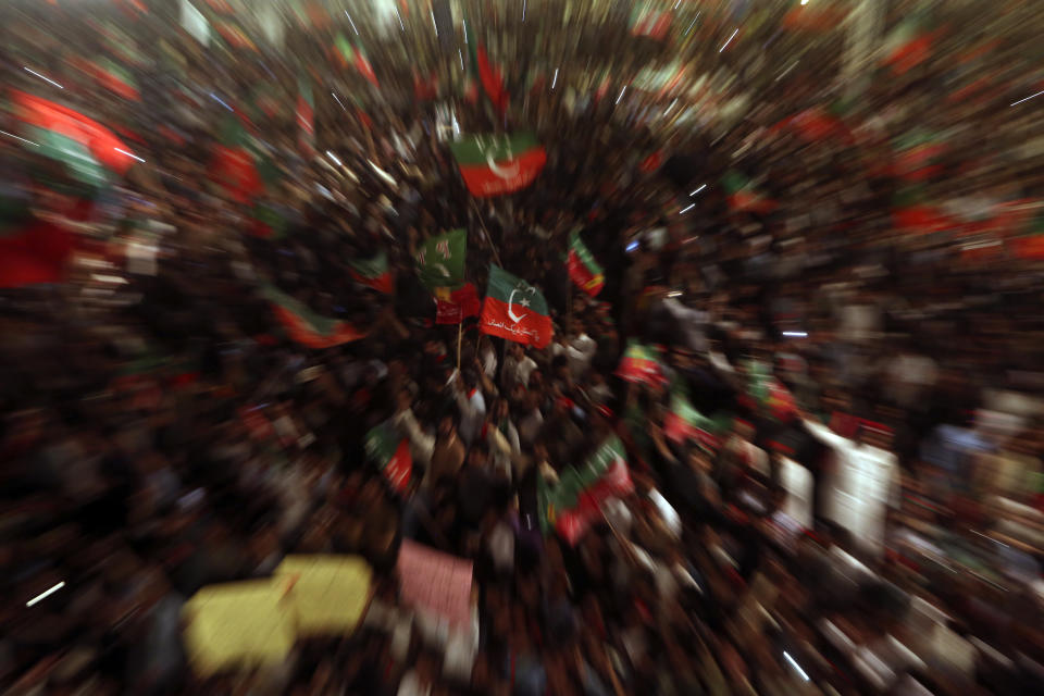 Supporters of Pakistani opposition leader Imran Khan's Tehreek-e-Insaf party attend a rally, in Peshawar, Pakistan, Tuesday, Sept. 6, 2022. Since he was toppled by parliament five months ago, former Prime Minister Imran Khan has demonstrated his popularity with rallies that have drawn huge crowds and signaled to his rivals that he remains a considerable political force. (AP Photo/Mohammad Sajjad)