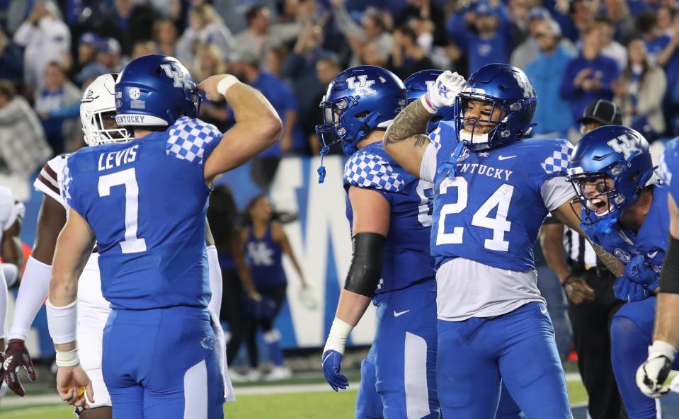 Kentucky’s Chris Rodriguez Jr. and Will Levis salute after his touchdown run against Mississippi State.Oct. 15, 2022