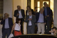 Greek ministers leave the Maximos Mansion after a governmental council in Athens, Greece June 27, 2015. REUTERS/Marko Djurica