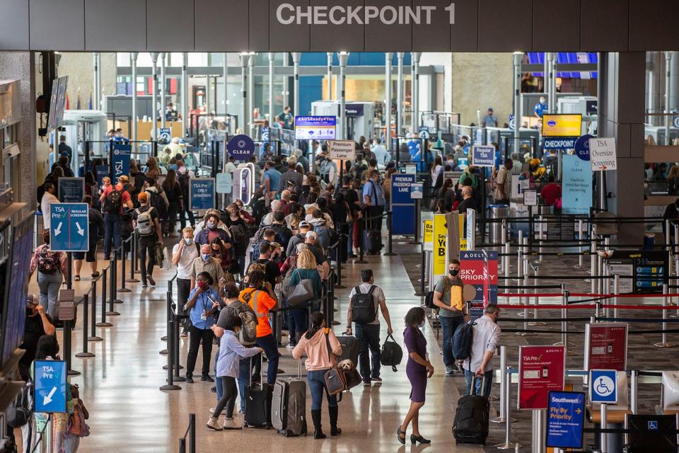 Travelers wait in line for TSA at Austin-Bergstrom International Airport on Friday, Dec. 17, 2021. Following a record-breaking Thanksgiving travel season, Austin-Bergstrom International Airport is advising travelers to expect a busy terminal during the upcoming Christmas and New Year’s season.