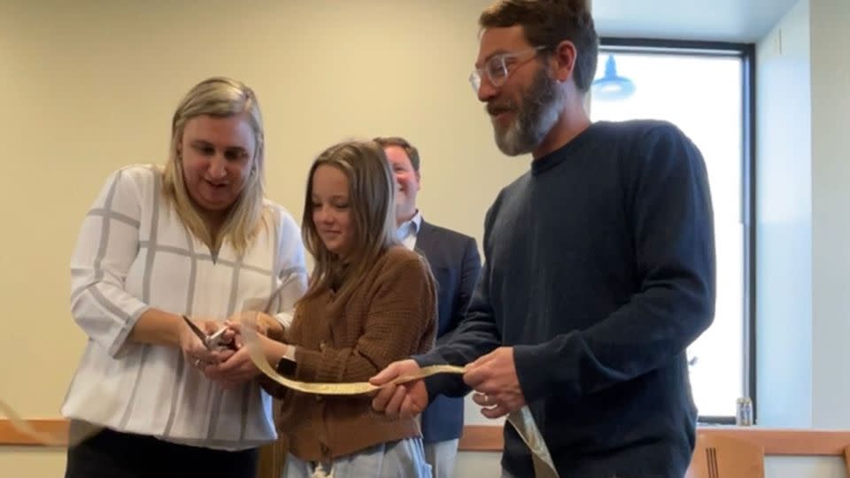 Caroline and Geoff Butler celebrate the clinic's opening with their daughter, Natalie. - Courtesy Caroline and Geoffrey Butler