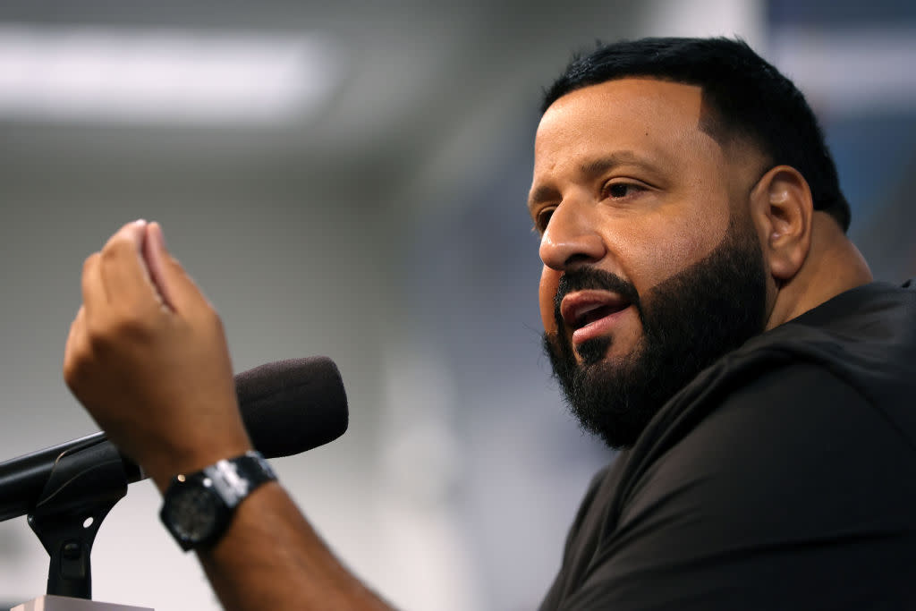 Here are some of the best Dj Khaled quotes. Pictured: DJ Khaled speaking at a press conference. | DAYTONA BEACH, FLORIDA - FEBRUARY 18: Honorary Starter,  DJ Khaled speaks to the media during a press conference after the NASCAR Cup Series Daytona 500 was postponed due to weather at Daytona International Speedway on February 18, 2024 in Daytona Beach, Florida. (Photo by Adam Glanzman/Getty Images)