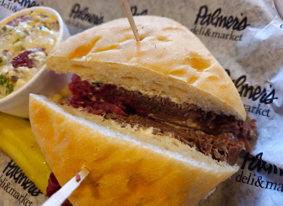 The Beef Eater at Palmer's Deli features steamed roast beef and pastrami with cream cheese on a ciabatta roll.