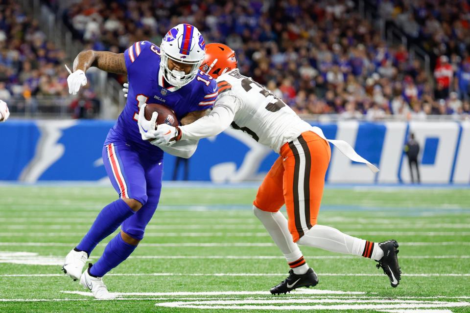 Buffalo Bills wide receiver Gabe Davis (13) is tackled by Cleveland Browns cornerback A.J. Green (38) on Nov. 20, 2022, in Detroit.