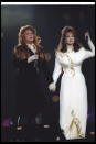 <div class="caption-credit">Photo by: Getty Images/Stephen Dunn</div>Wynonna and Naomi Judd wore many yards of material between them in 1994, for the Super Bowl XXVIII's theme of "Rockin' Country Sunday." <br>