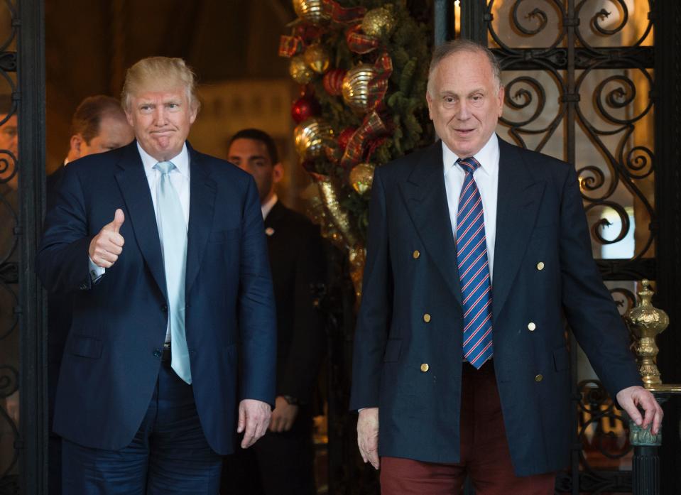 US President-elect Donald Trump gestures next to Ronald Lauder, President of the World Jewish Congress,  after a meeting on December 28, 2016 at Mar-a-Lago in Palm Beach, Florida. / AFP / DON EMMERT        (Photo credit should read DON EMMERT/AFP/Getty Images)