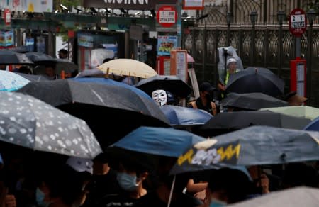 Anti-government demonstrators march in protest against the invocation of the emergency laws in Hong Kong