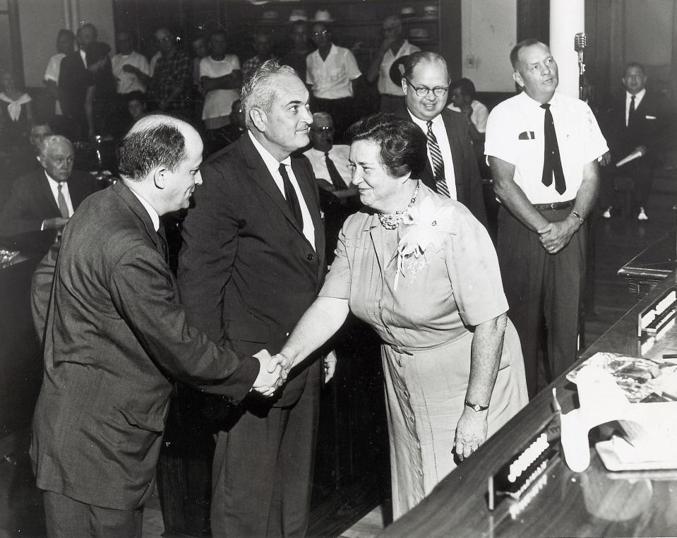 Knox County Schools Superintendent Mildred Doyle shakes hands with Board of Education member Wallace Burroughs after her swearing in on Sept. 1, 1960. In 1946, Doyle was the first woman elected superintendent, a post she held for 30 years.