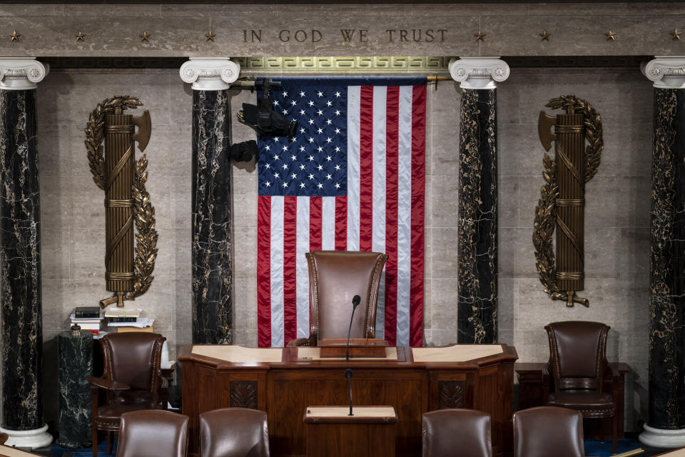 FILE - The speaker's dais is seen in the House of Representatives of the Capitol in Washington, Feb. 28, 2022. After House Speaker Kevin McCarthy was voted out of the job by a contingent of hard-right conservatives this week, House GOP leaders are now grappling to find a new speaker. With no speaker of the House, a constitutional officer second in line to the presidency, the Congress cannot fully function — to pass laws, fund the government and otherwise serve as the branch of government closest to the people — during a time of simmering uncertainty at home and abroad. (AP Photo/J. Scott Applewhite, File)