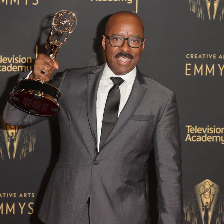 Courtney B. Vance posing on the Emmys red carpet