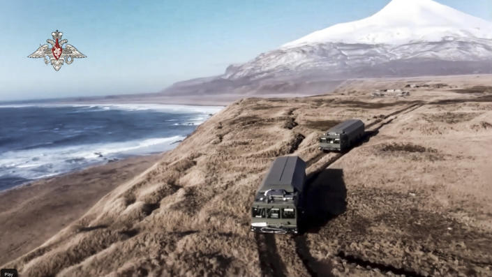 In this handout photo released by Russian Defense Ministry Press Service, Bastion missile launchers move to their positions on the Matua Island, part of the Kurils Islands chain, in Russia, Thursday, Dec. 2, 2021. The Russian military has deployed the Bastion coastal defense missile systems on the Matua Island, which is close to several islands also claimed by Japan, a move intended to underline Moscow's firm stance in the dispute. (Russian Defense Ministry Press Service via AP)