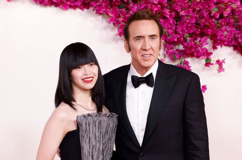 Nicolas Cage (R) and Riko Shibata attend the Academy Awards in March. File Photo by John Angelillo/UPI