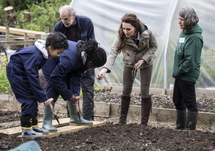 <i>The Duchess also helped children with some vegetable planting [Photo: PA]</i>