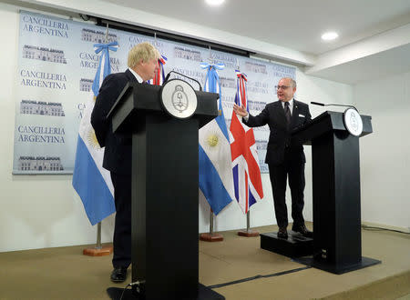 Argentina's Foreign Minister Jorge Faurie gestures next to Britain's Foreign Secretary Boris Johnson during a news conference in Buenos Aires, Argentina, May 22, 2018. REUTERS/Marcos Brindicci