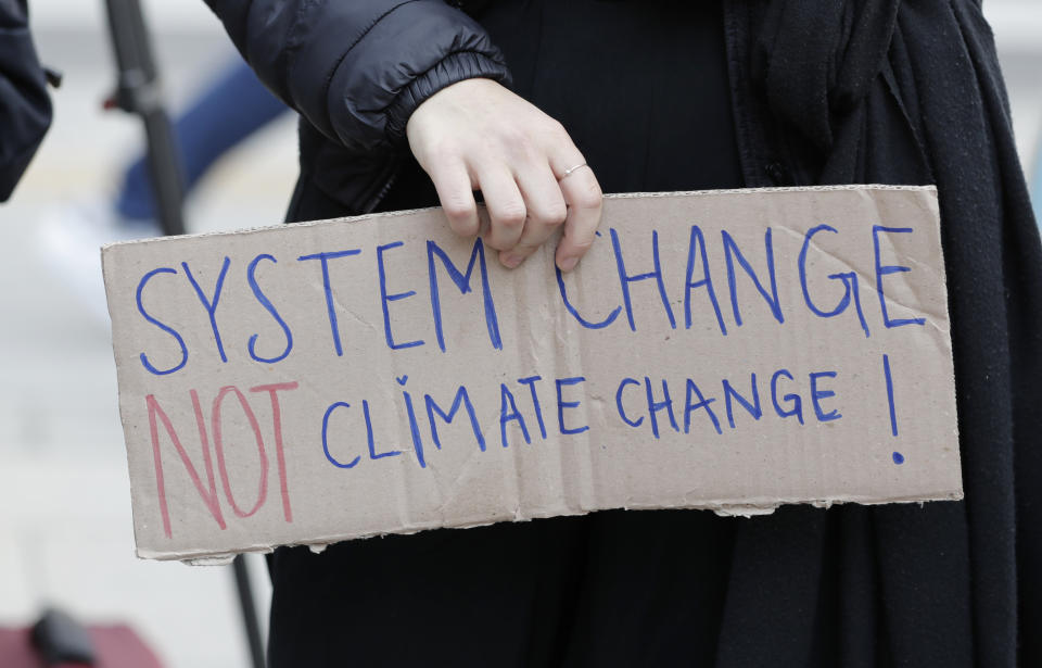 A participant holds a sign during a rally for global climate strike for future in Seoul, South Korea, Friday, March 15, 2019. About 150 students and other protesters attended a rally to protest their governments' failure to take sufficient action against climate change. (AP Photo/Lee Jin-man)