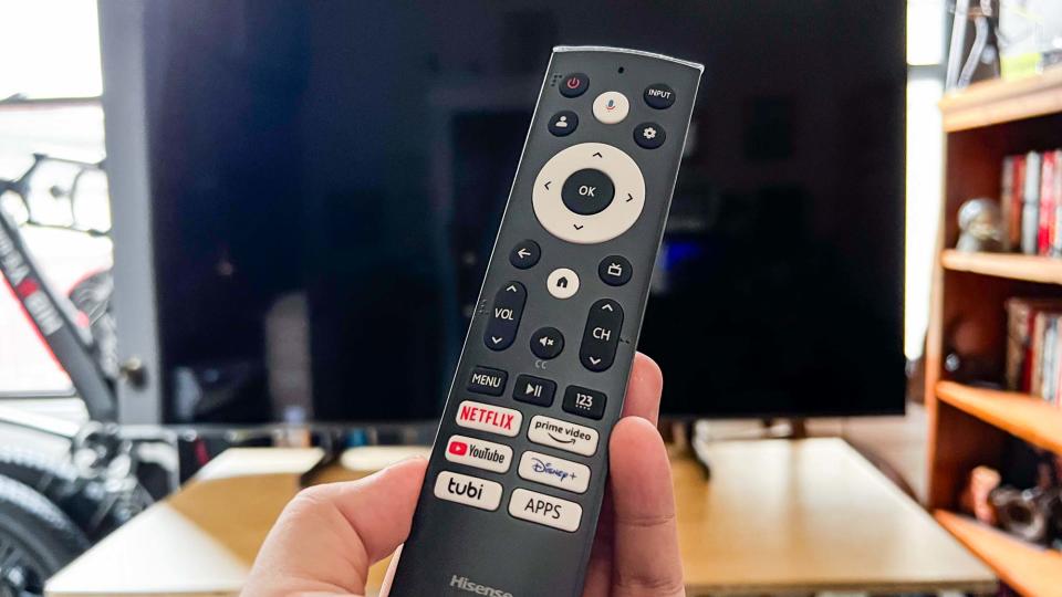 Hisense U7K remote in front of TV