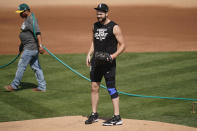 Chicago White Sox pitcher Lucas Giolito stands on the mound at practice during a baseball workout in Oakland, Calif., Monday, Sept. 28, 2020. The White Sox are scheduled to play the Oakland Athletics in an American League wild-card playoff series starting Tuesday. (AP Photo/Jeff Chiu)