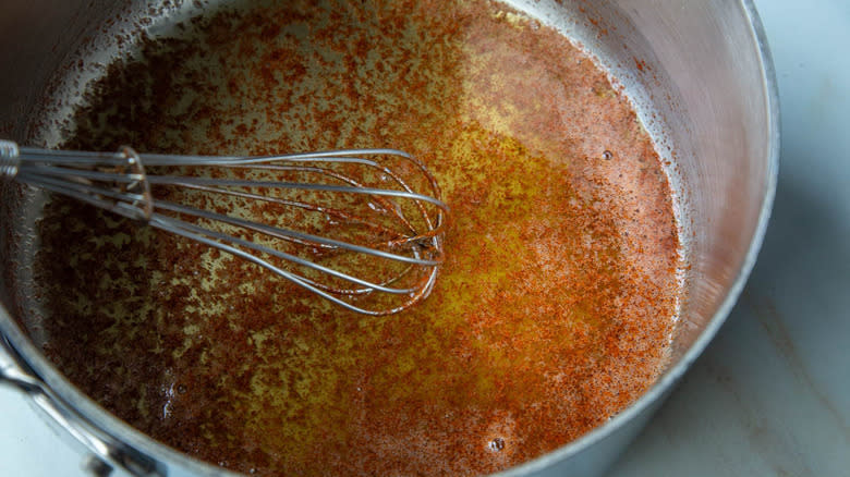 spiced melted butter with whisk