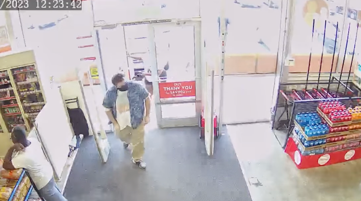 The gunman (center) is captured on security cameras walking into a Family Dollar, just a mile and a half away from the Dollar General where he carried out a shooting (Jacksonville Sheriff’s Office)