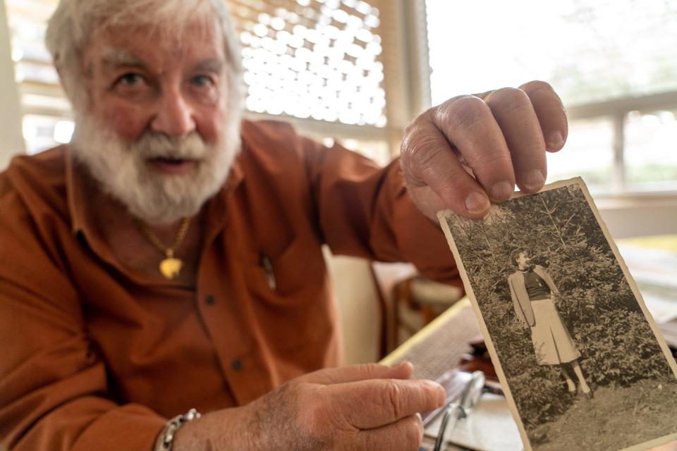 Werner Salinger, 90, sorts through photographs and letters written by his wife, Martha Salinger, 89, at their home in Gold Canyon on Jan. 13, 2023.