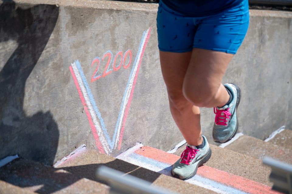 Jackson City Councilmember Candace Busby crosses the 2200 step marker during the 2nd Annual Patriot Day Memorial Stair Climb at the Ballpark at Jackson on Saturday, Sept. 9, 2023.