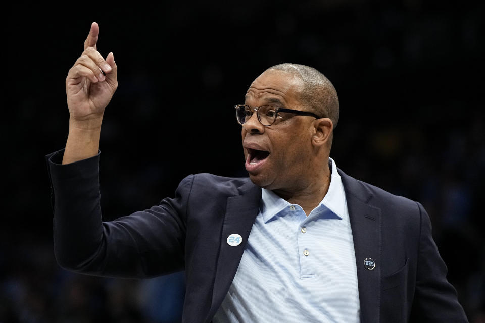 North Carolina head coach Hubert Davis yells during the first half of an NCAA college basketball game against Oklahoma Wednesday, Dec. 20, 2023, in Charlotte, N.C. (AP Photo/Chris Carlson)