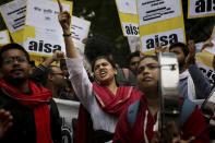 Indian students shout slogans during a protest march towards the Parliament in New Delhi, India, Saturday, Nov. 23, 2019. Hundreds of students of the Jawaharlal Nehru University (JNU) were joined by students from other universities, activists and members of civil society as they marched towards India's parliament to protest against the hostel fee hike, along with their other demands. (AP Photo/Altaf Qadri)