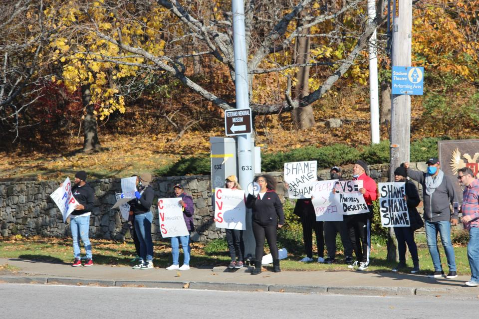 Activists protest outside CVS' Woonsocket headquarters Thursday.