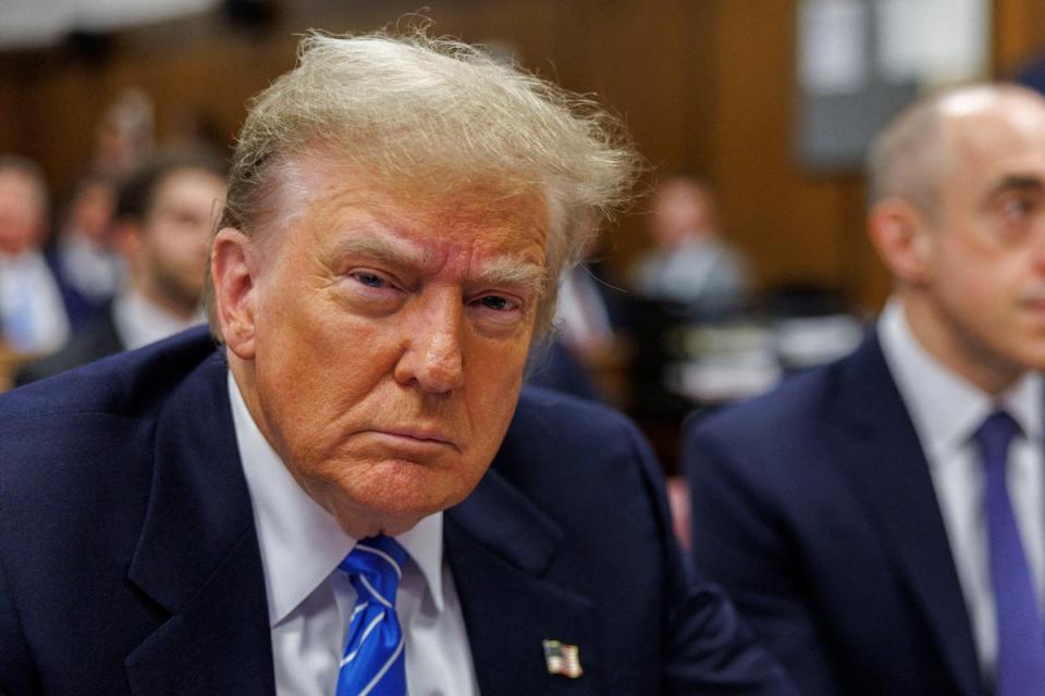 Donald Trump appears in a Manhattan courtroom for his hush money trial on 13 May (POOL/AFP via Getty Images)