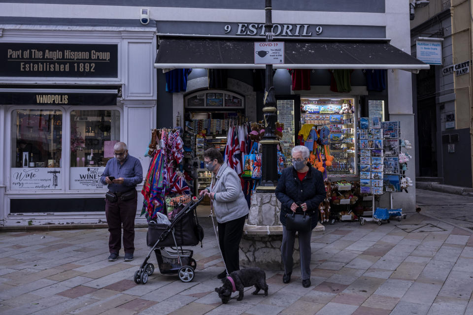 Two elderly woman walk past a souvenir shop in Gibraltar, Thursday, March 4, 2021. Gibraltar, a densely populated narrow peninsula at the mouth of the Mediterranean Sea, is emerging from a two-month lockdown with the help of a successful vaccination rollout. The British overseas territory is currently on track to complete by the end of March the vaccination of both its residents over age 16 and its vast imported workforce. But the recent easing of restrictions, in what authorities have christened “Operation Freedom,” leaves Gibraltar with the challenge of reopening to a globalized world with unequal access to coronavirus jabs. (AP Photo/Bernat Armangue)