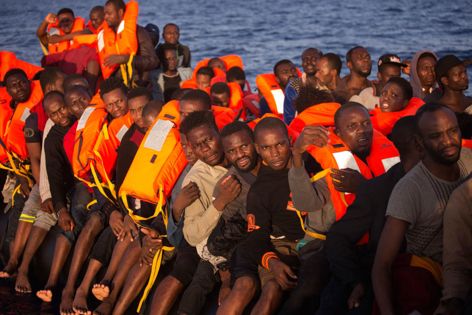 <p>Migrants, many from Nigeria, crowd onto a dinghy as the sail fleeing Libya, before being helped by members of a Spanish NGO, during a rescue operation at the Mediterranean sea, about 17 miles north of Sabratah, Libya, Saturday, Aug. 20, 2016. (AP Photo/Emilio Morenatti) </p>