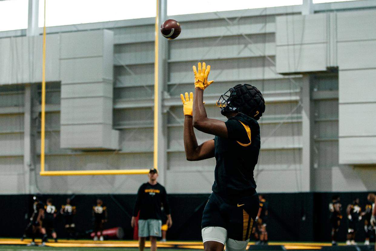 Missouri freshman tight end Jordon Harris opens his arms to catch a football during a training camp practice this August.