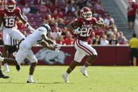 Arkansas running back Dominique Johnson (20) slips past Georgia Southern corner back Darrell Baker Jr. (14) for a big gain during the first half of an NCAA college football game Saturday, Sept. 18, 2021, in Fayetteville, Ark. (AP Photo/Michael Woods)