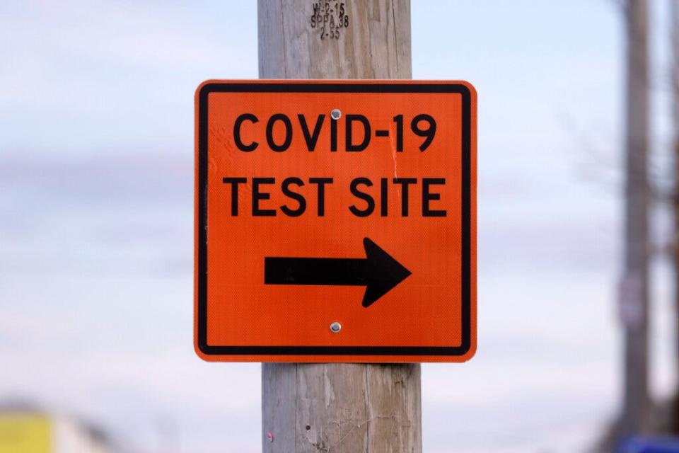 A sign along Division Street in Pawtucket directing drivers to COVID testing at McCoy Stadium.