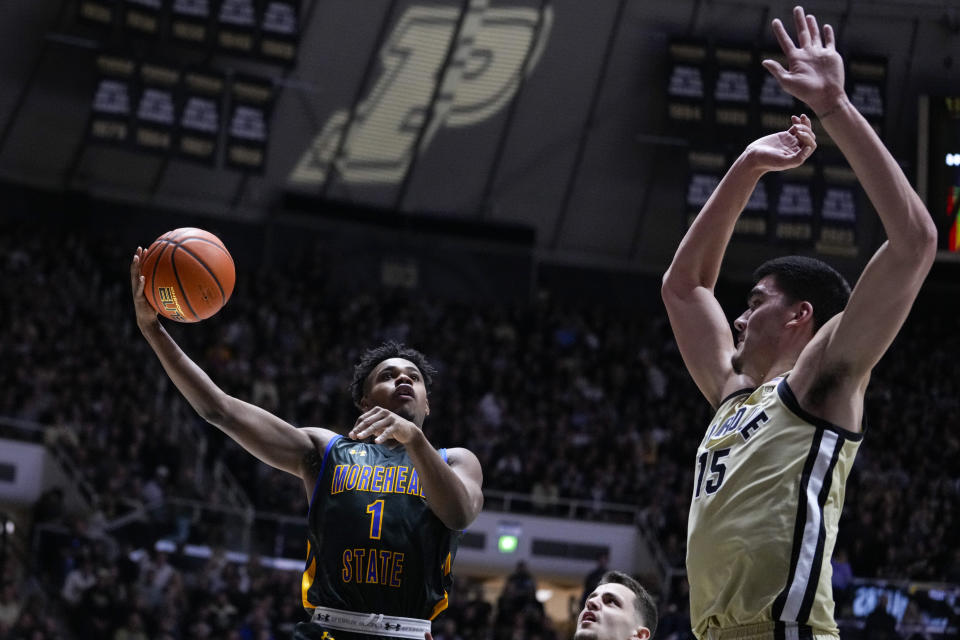 Morehead State guard Jerone Morton (1) shoots over Purdue center Zach Edey (15) during the first half of an NCAA college basketball game in West Lafayette, Ind., Friday, Nov. 10, 2023. (AP Photo/Michael Conroy)