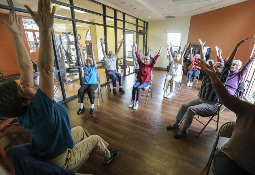 Residents at the St. Paul's Plaza independent and assisted living facility attend the Gentle Stretch class led by fitness coordinator Janet Blair (left) on March 10, 2020 in Chula Vista, California. Residents of the facility are staying active despite cancelation of all activities involving members of the public coming to the facility. Students from High Tech High were scheduled to attend the facility but the event was cancelled.