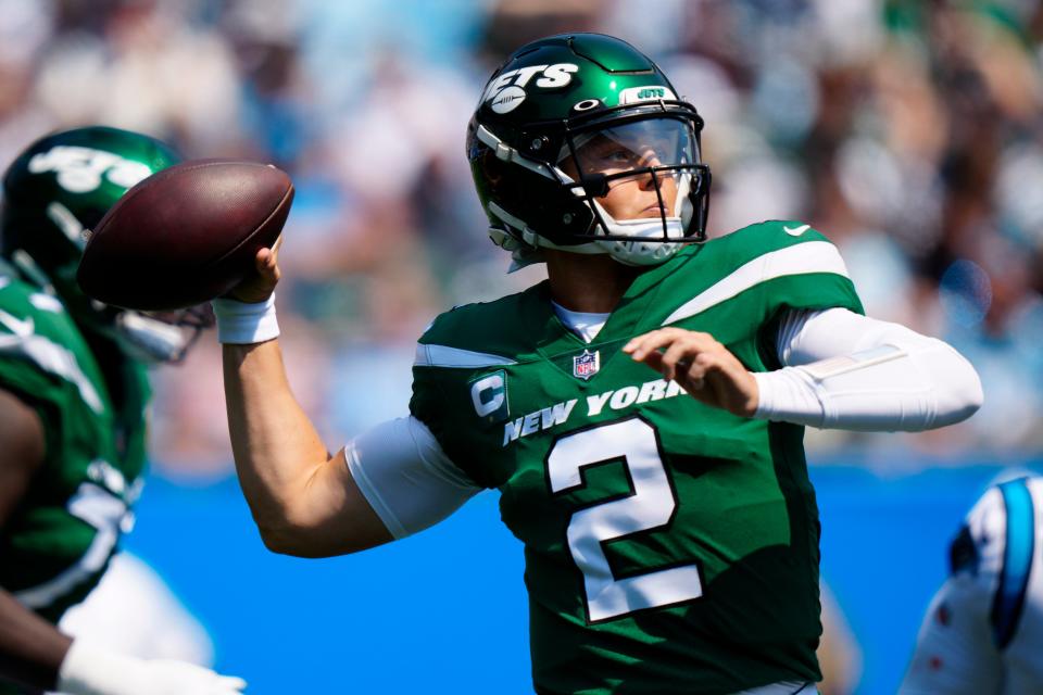 New York Jets quarterback Zach Wilson passes against the Carolina Panthers during the first half of an NFL football game Sunday, Sept. 12, 2021, in Charlotte, N.C. (AP Photo/Jacob Kupferman)