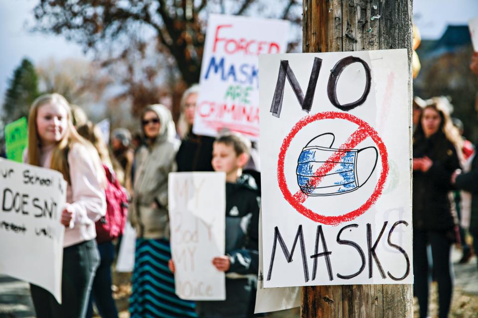 Demonstrators protest mask requirements on March 9 outside Flathead High School in Kalispell, Montana.