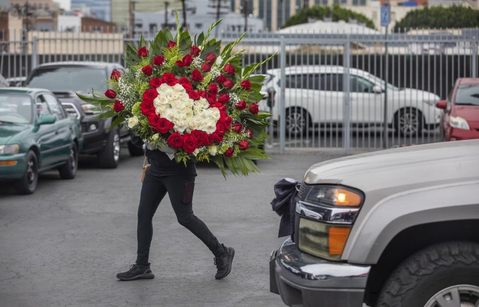 Woman carrying flowers