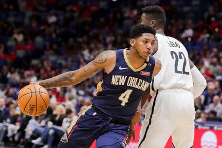 Oct 26, 2018; New Orleans, LA, USA; New Orleans Pelicans guard Elfrid Payton (4) dribbles against Brooklyn Nets guard Caris LeVert (22) in the first half at Smoothie King Center. Mandatory Credit: Stephen Lew-USA TODAY Sports